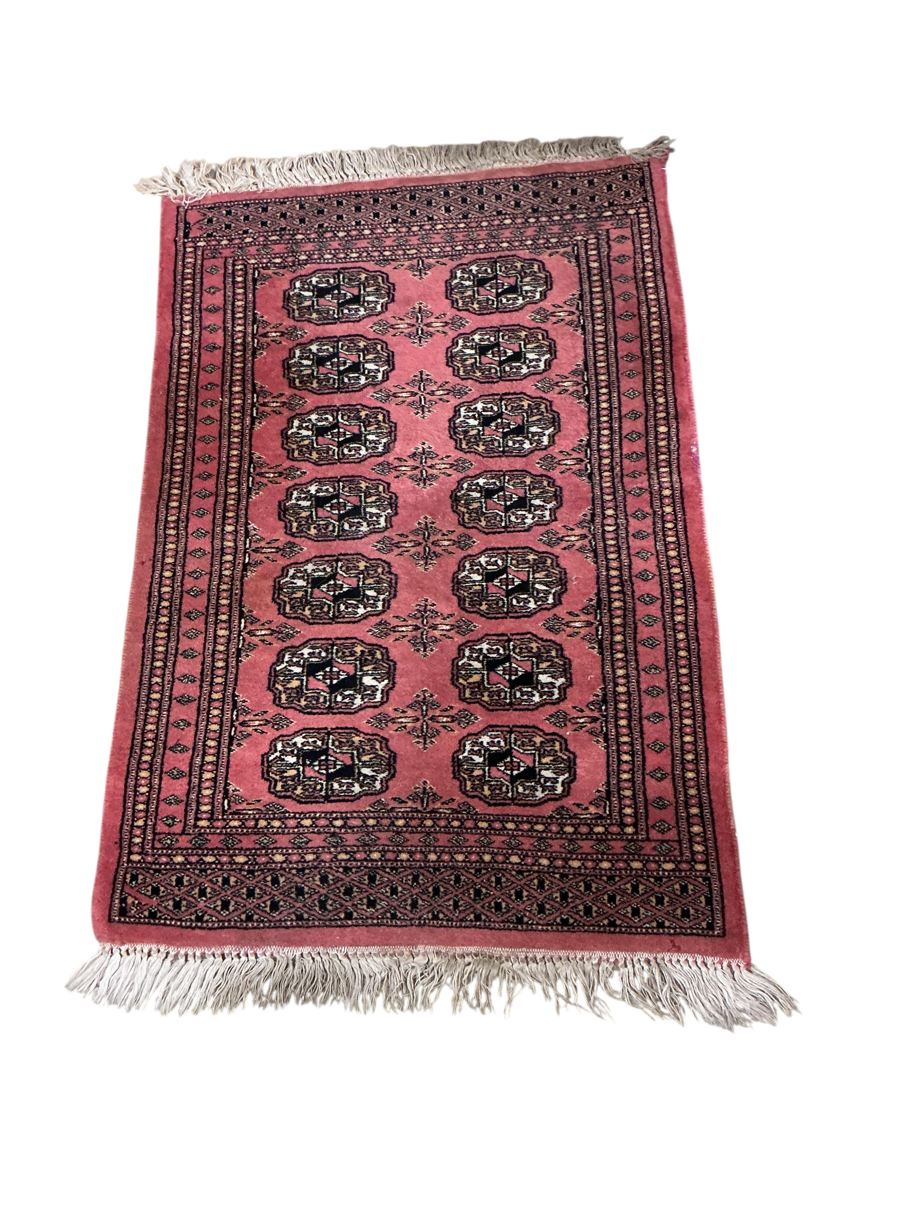 An Afghan blue ground rug 208 x 116cm, an Afghan mat and two Bokhara rugs